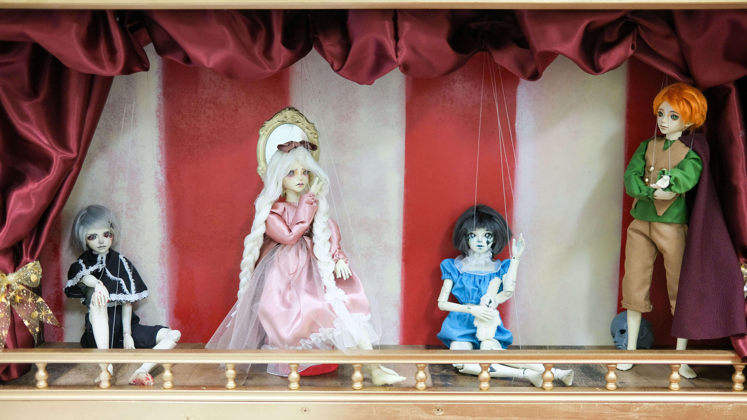 Psyche’s Puppets, 2023, installation, digital print on canvas, sculpture, four 18" × 24" paintings, 14" dolls, 41" × 26" stage display (detail)